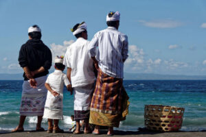 Men by the beach praying