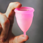 Hand holding a menstrual cup